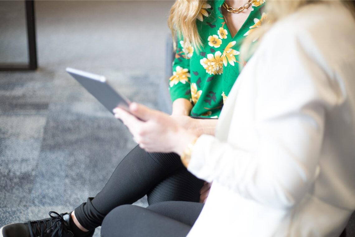 Two people looking at tablet