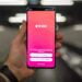 Person holding black samsung android smartphone, Tinder app opened