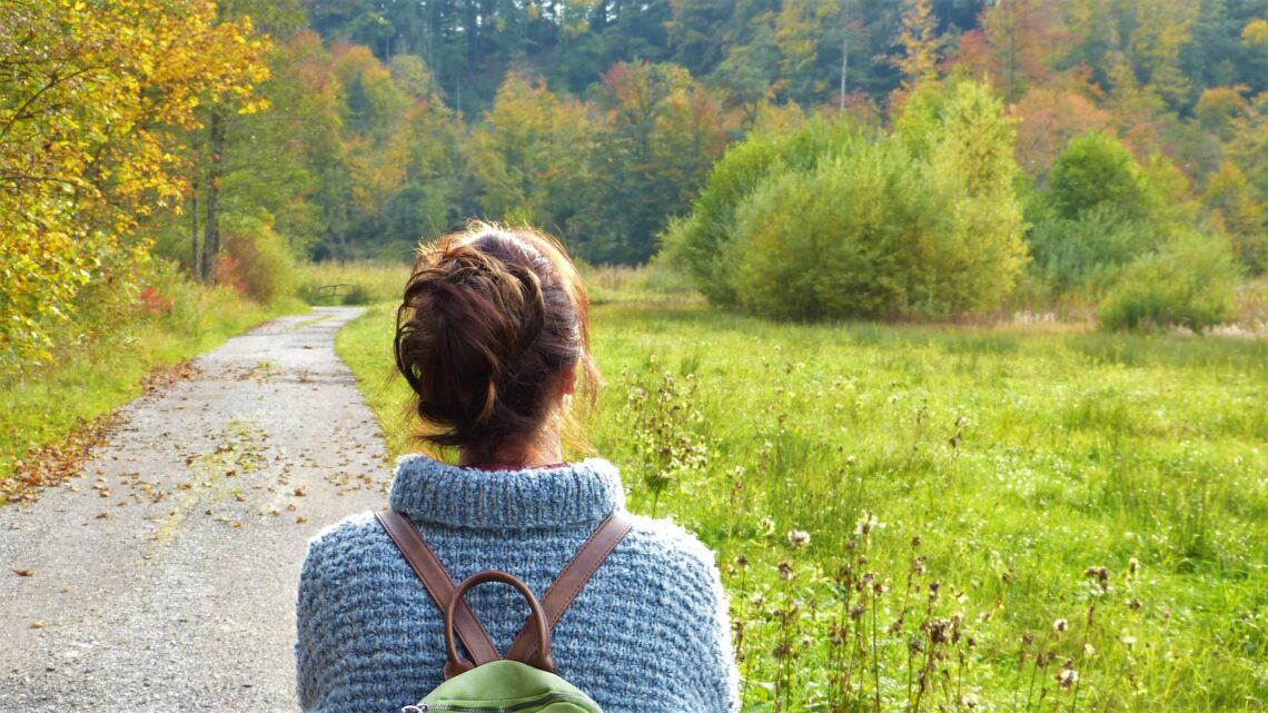 Woman with backpack in nature