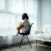 Woman sitting on chair alone