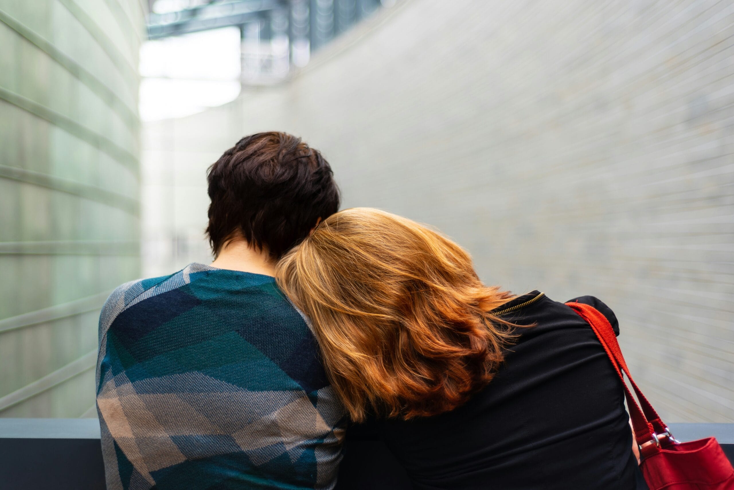 Image of two people sitting from behind