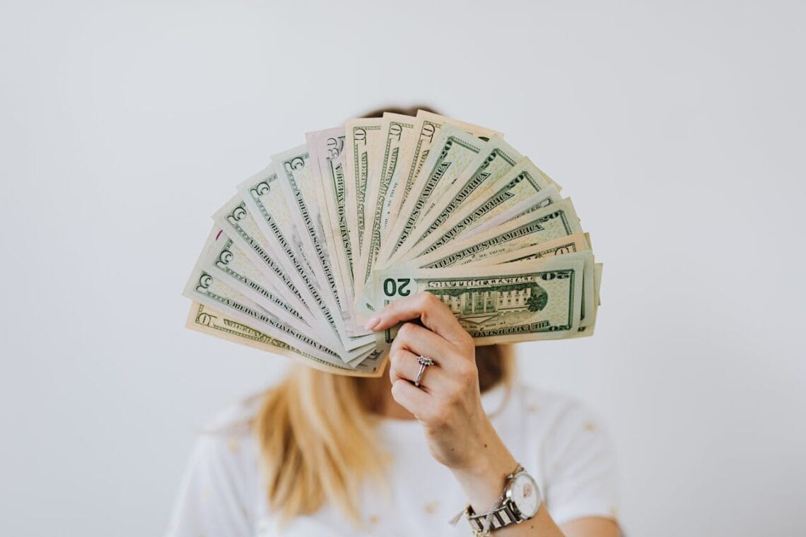 Image of woman holding money