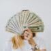 Image of woman holding money